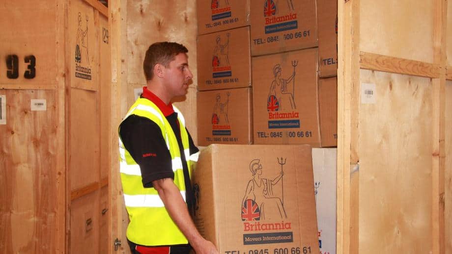 image of man packing boxes into storage unit