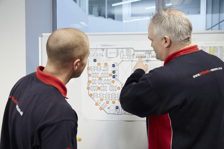 image of men planning removal with map