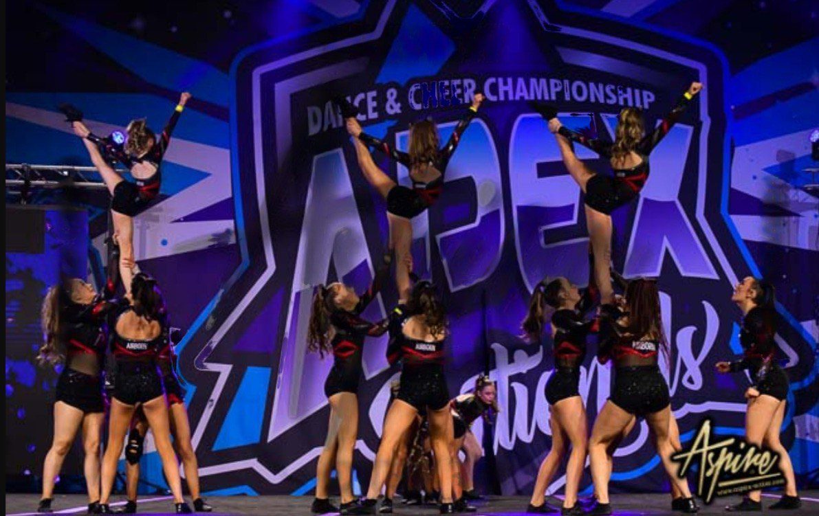 The Airborne Allstars impressively showcased their skills as a cheerleading group at a competition.